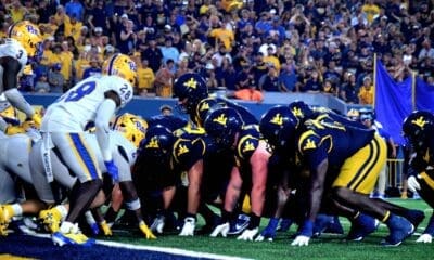 WVU Football offense lines up near end zone against Pitt in Backyard Brawl