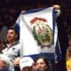 WVU fans with West Virginia flag