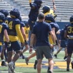 WVU Football’s Garrett Greene and Lee Kpogba have some fun during practice