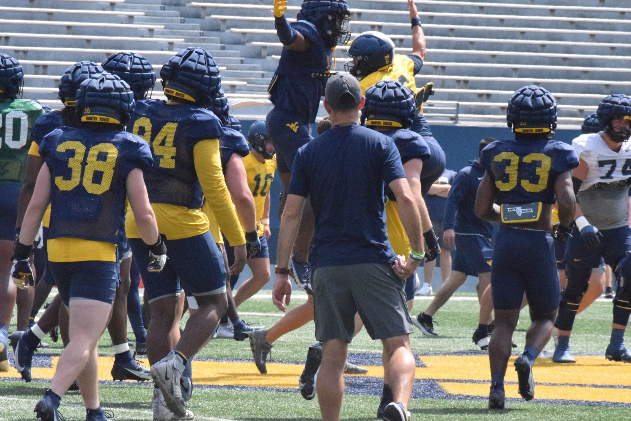 WVU Football’s Garrett Greene and Lee Kpogba have some fun during practice