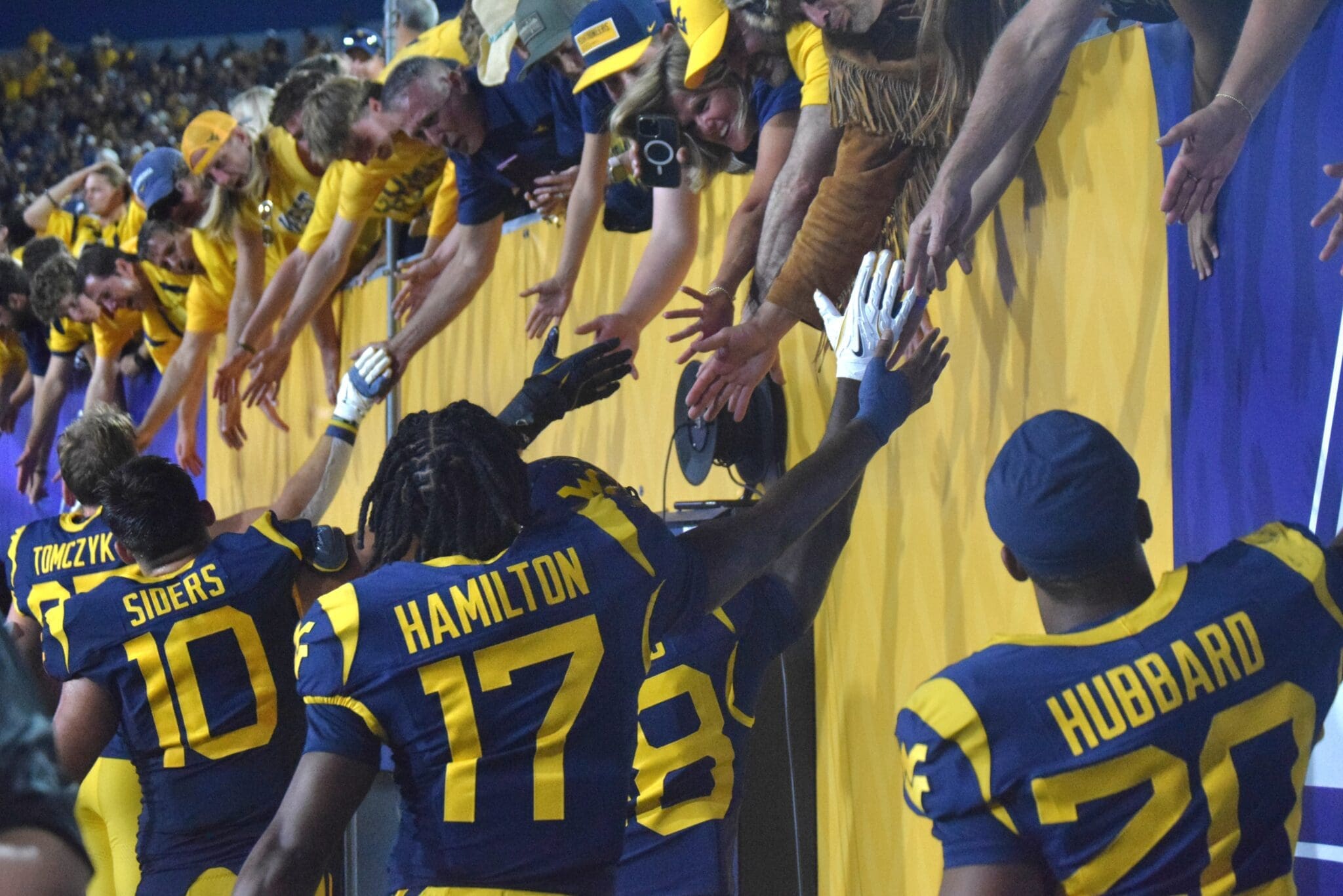 WVU Football players and fans after beating Pitt in Backyard Brawl