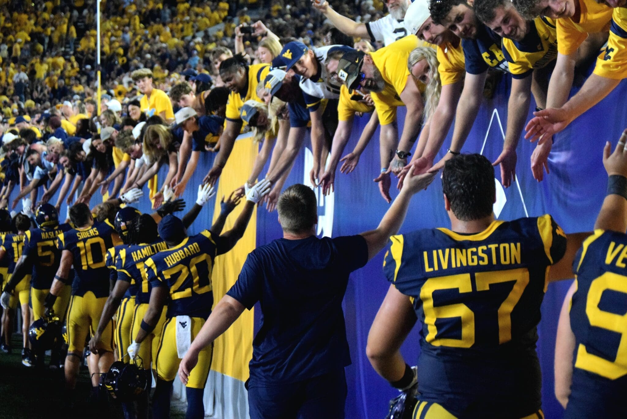 WVU Football players and fans after beating Pitt in Backyard Brawl