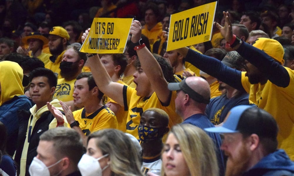 WVU Basketball Fans with Gold Rush sign