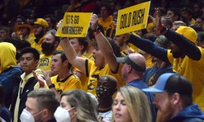 WVU Basketball Fans with Gold Rush sign
