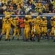 WVU Football Defense congratulates each other