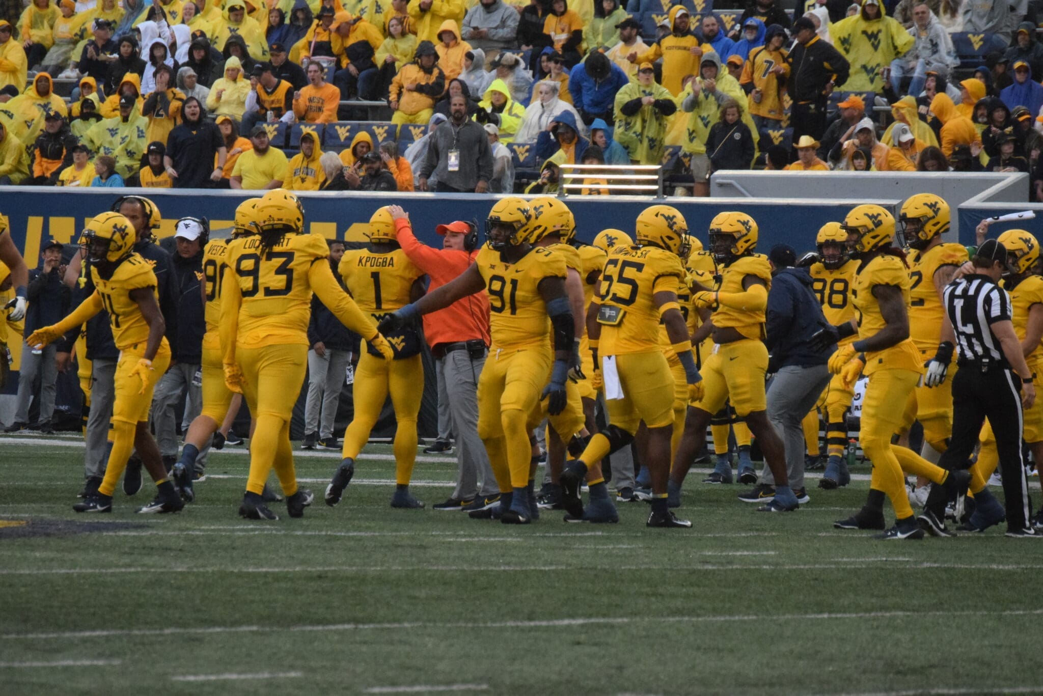 WVU Football Defense congratulates each other