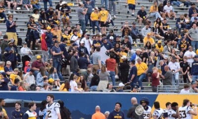 WVU Football Rich Rodriguez in stands with fans during spring showcase