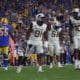 WVU football defense of Sean Martin, Dante Stills and Jared Bartlett
