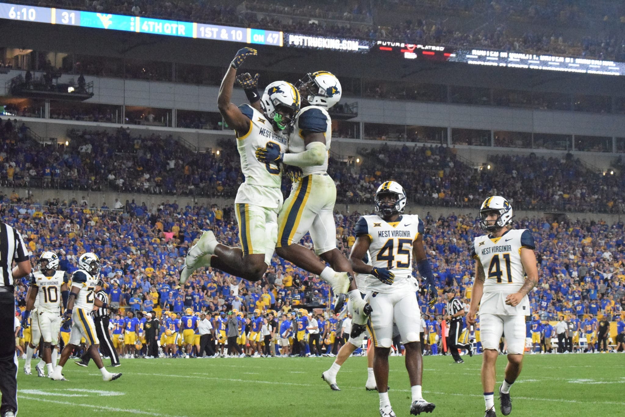 WVU defense celebrates at Pitt in Backyard Brawl