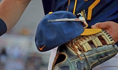 WVU Baseball hat and glove stock