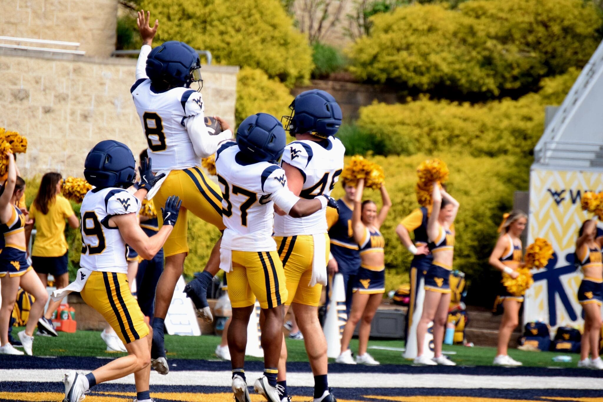 WVU Football defense including Kamari Wilson celebrating during scrimmage