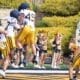 WVU Football offense with Carter Zuliani celebrating during scrimmage