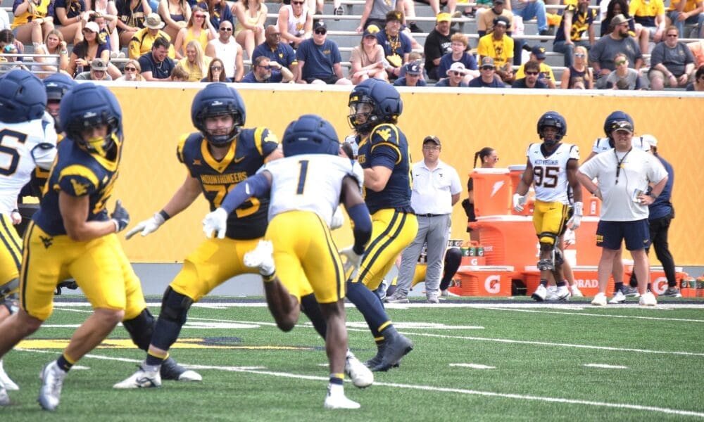 WVU Football DB Geimere Latimer rushing during scrimmage