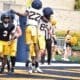 WVU Football QB Michael Hawkins near WR Robert Oliver and RB Chris Talley celebrating during a scrimmage