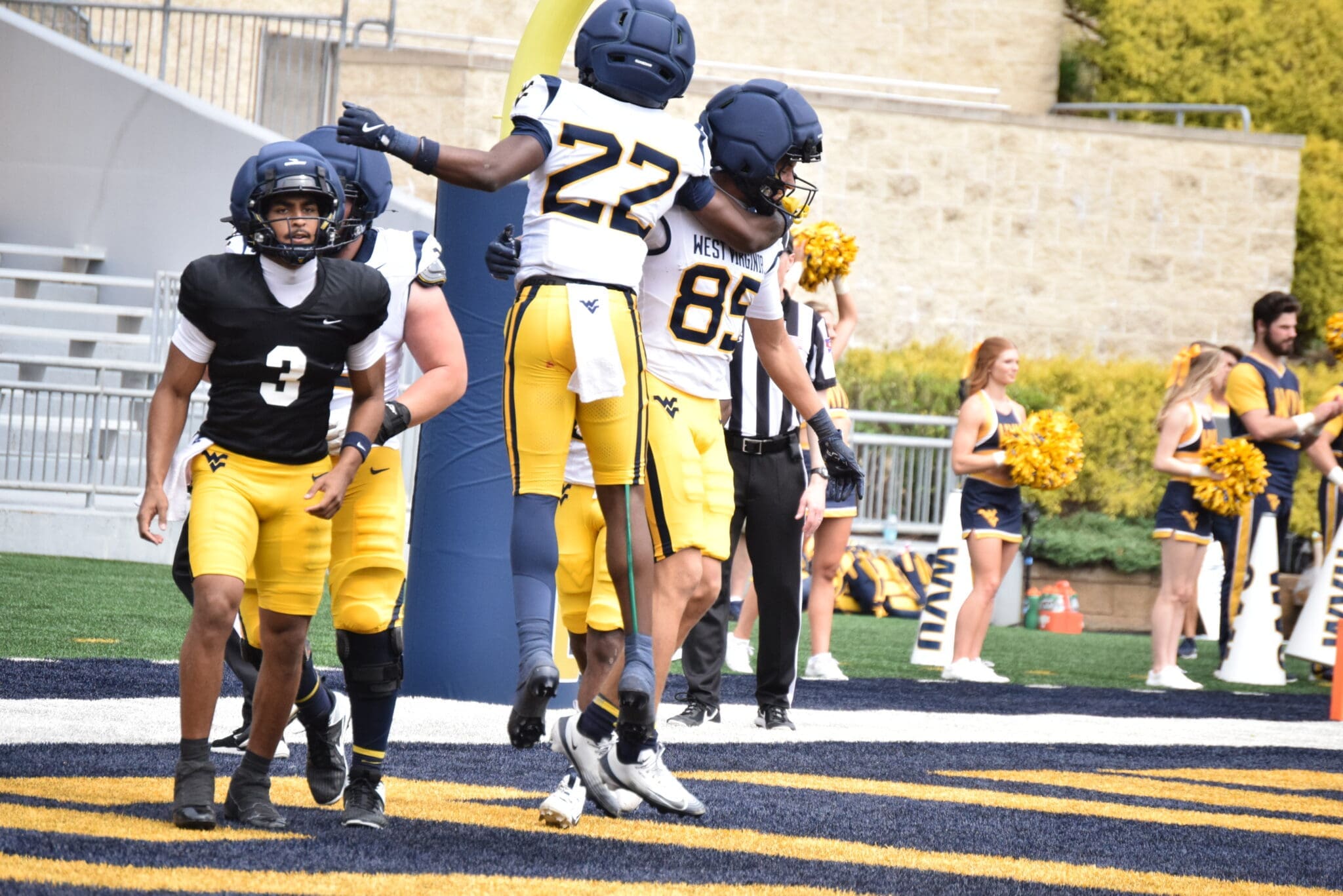 WVU Football QB Michael Hawkins near WR Robert Oliver and RB Chris Talley celebrating during a scrimmage