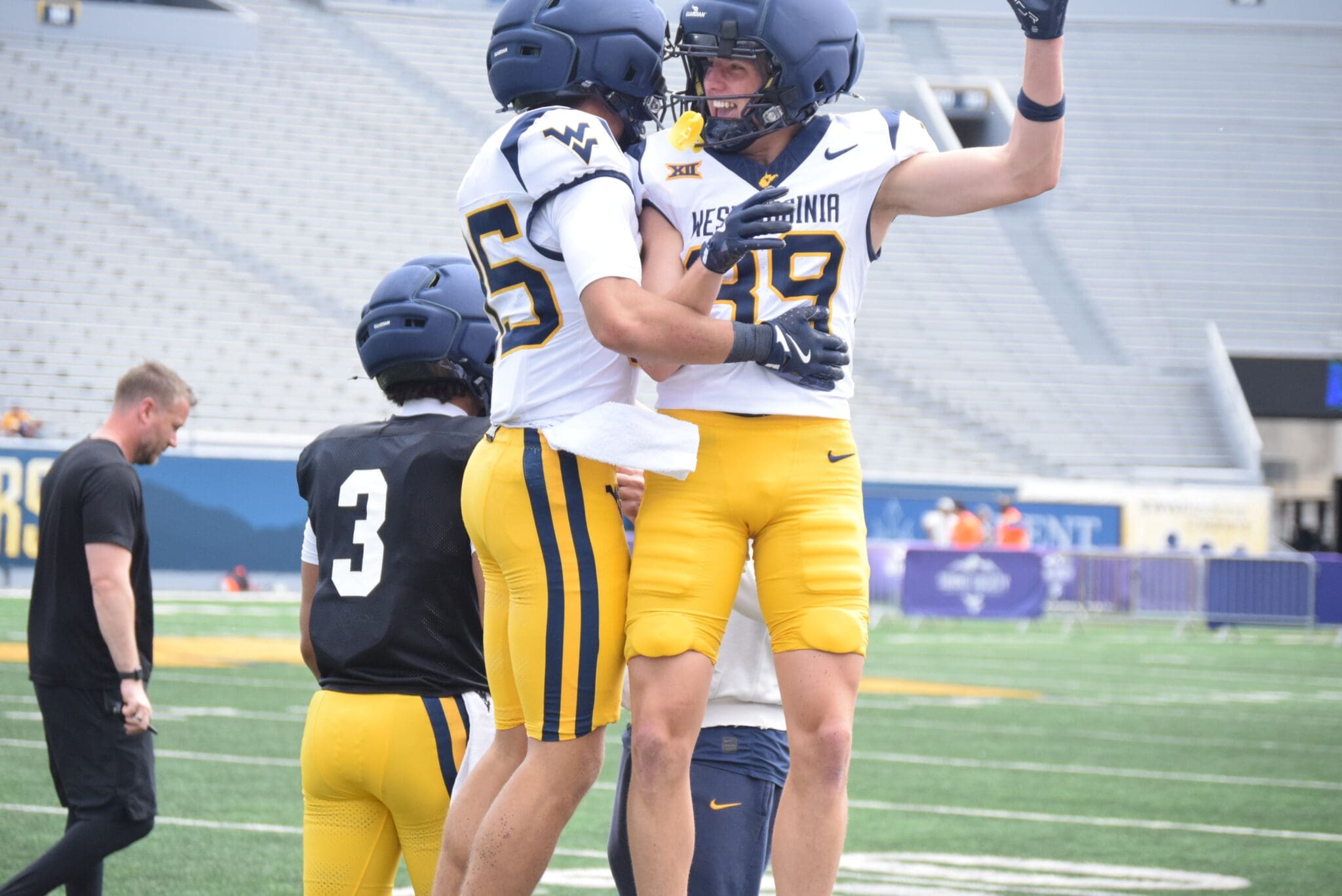 WVU Football Kicker Peter Notaro celebrating with a teammate during a scrimmage