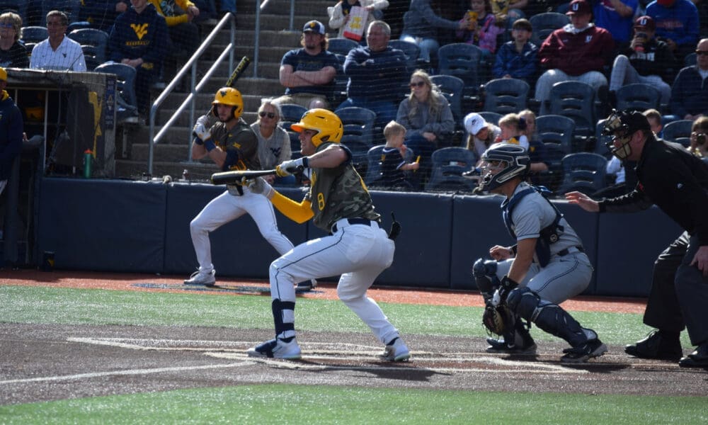 WVU baseball catcher Dayne Leonard drops a bunt.