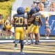 WVU Football RB Martavious Boswell runs to celebrate TD in end zone of scrimmage