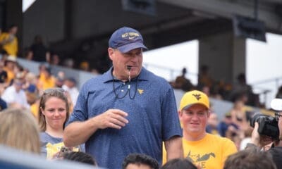WVU Football HC Rich Rodriguez with fans during spring scrimmage