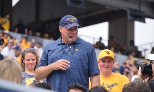WVU Football HC Rich Rodriguez with fans during spring scrimmage