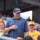 WVU Football HC Rich Rodriguez with fans during spring scrimmage