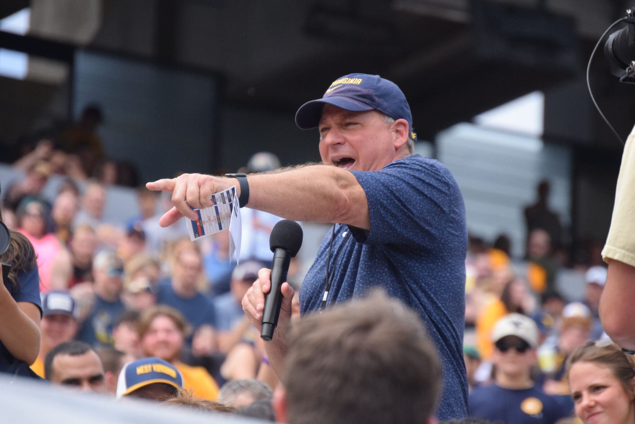 WVU Football HC Rich Rodriguez with fans during spring scrimmage