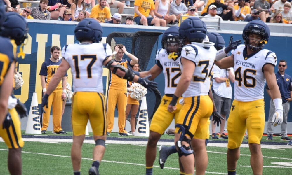 WVU Football Miles Khatri with teammates during scrimmage