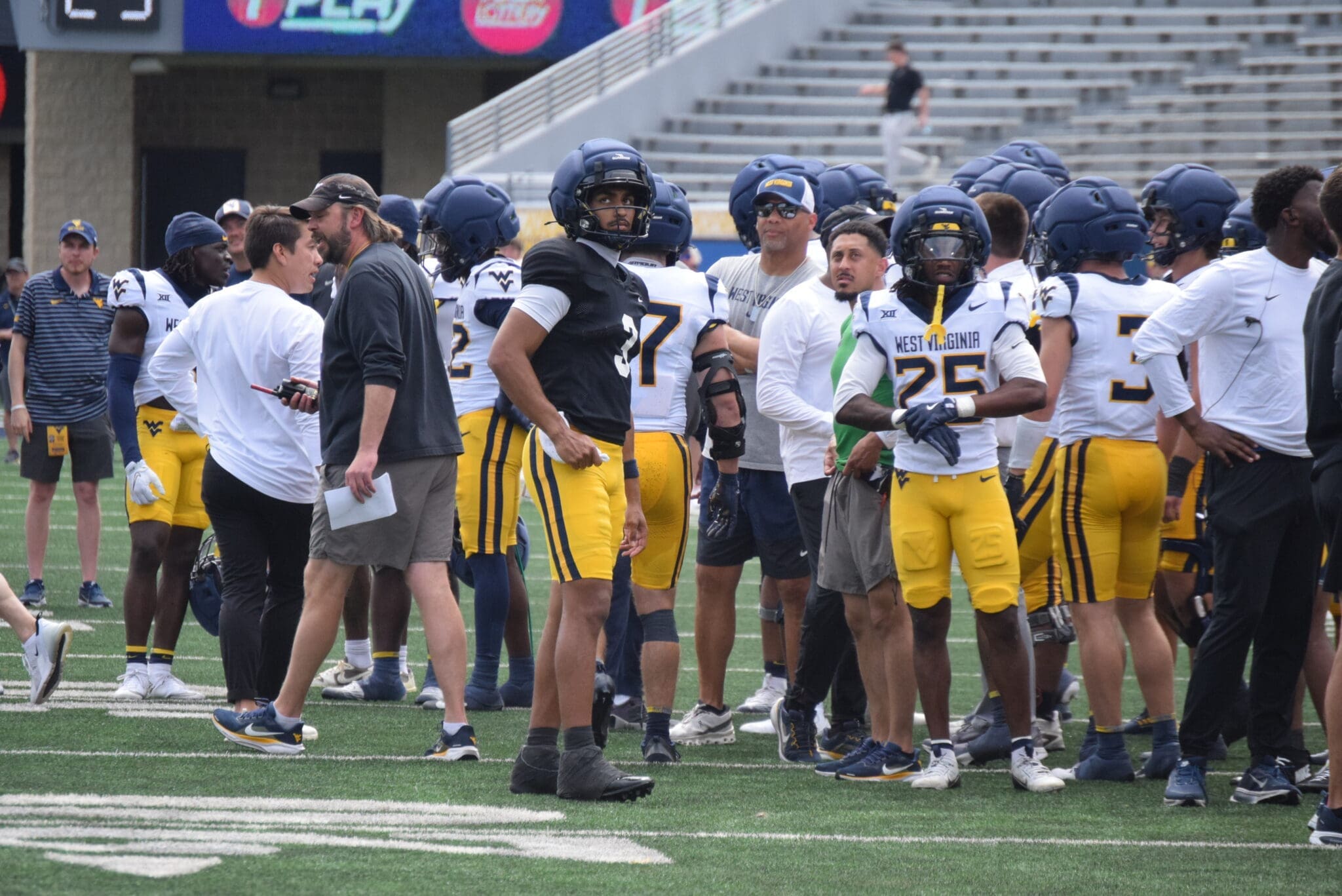 WVU Football QB Michael Hawkins and WR Armoni Weaver-Bomar with teammates during scrimmage