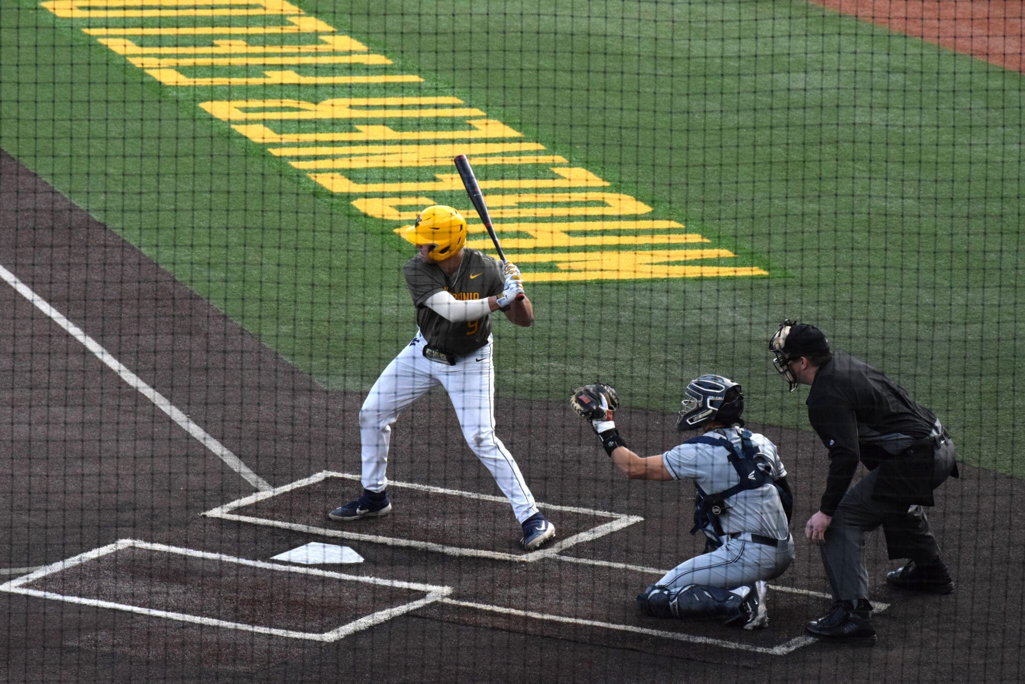 WVU Baseball first baseman Grant Hussey stands in the batter's box.