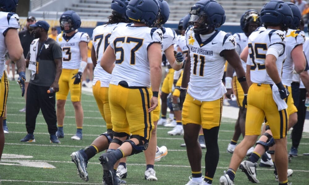 WVU Football players, including TaRon Francis at scrimmage