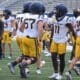 WVU Football players, including TaRon Francis at scrimmage