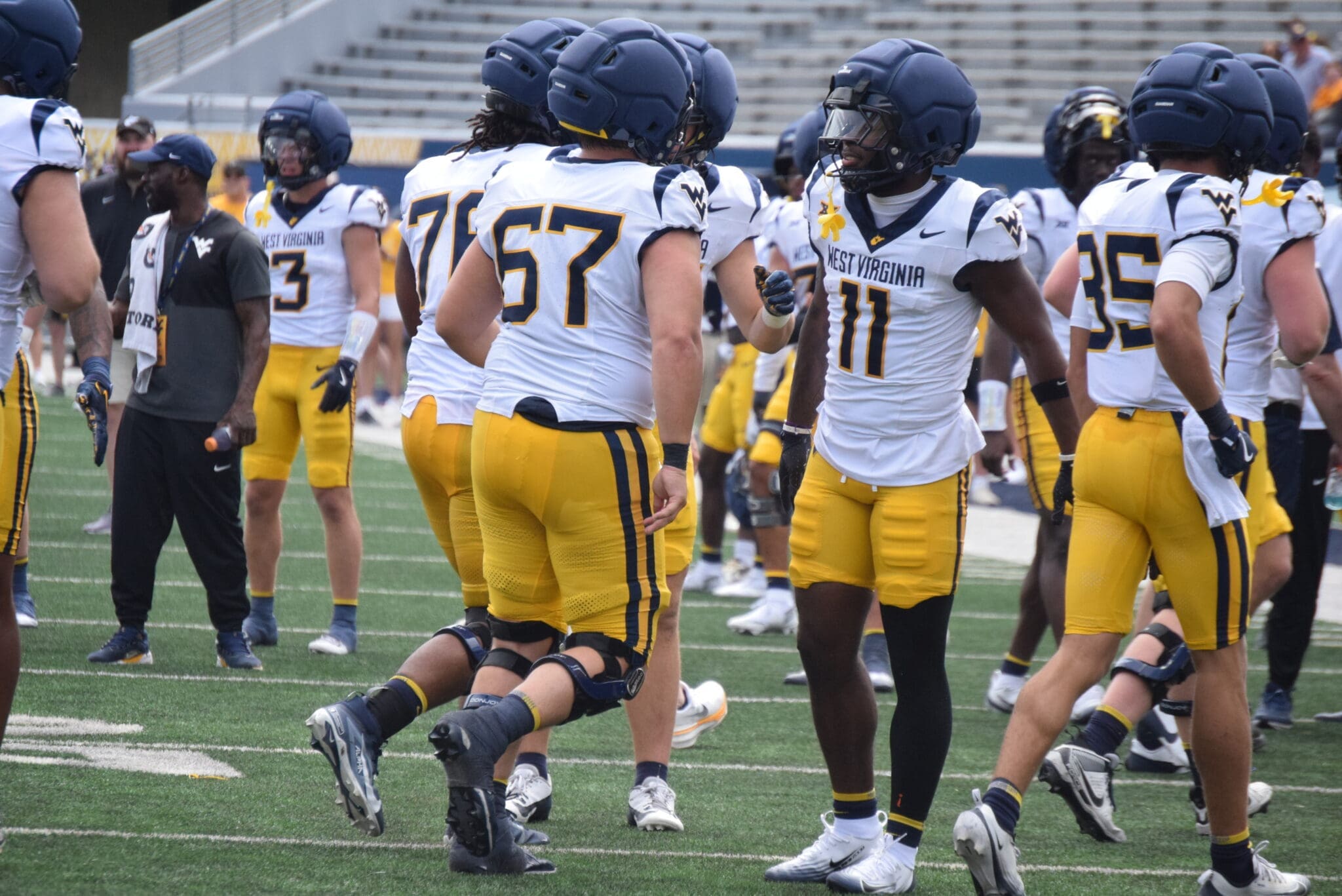 WVU Football players, including TaRon Francis at scrimmage