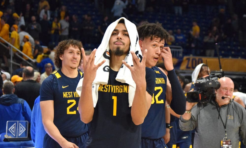 Emmitt Matthews Jr. symbolizes "WV" after win.