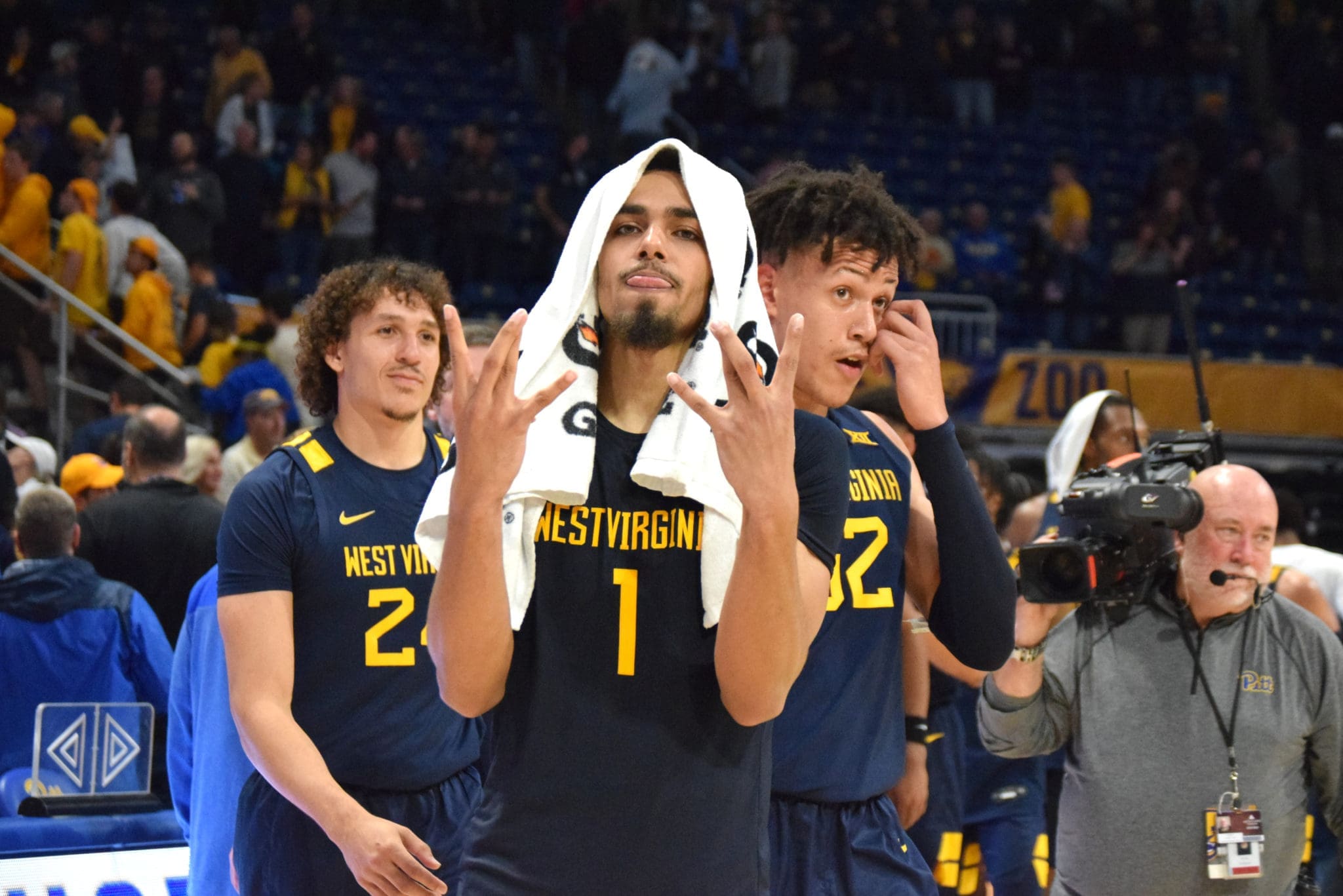 Emmitt Matthews Jr. symbolizes "WV" after win.