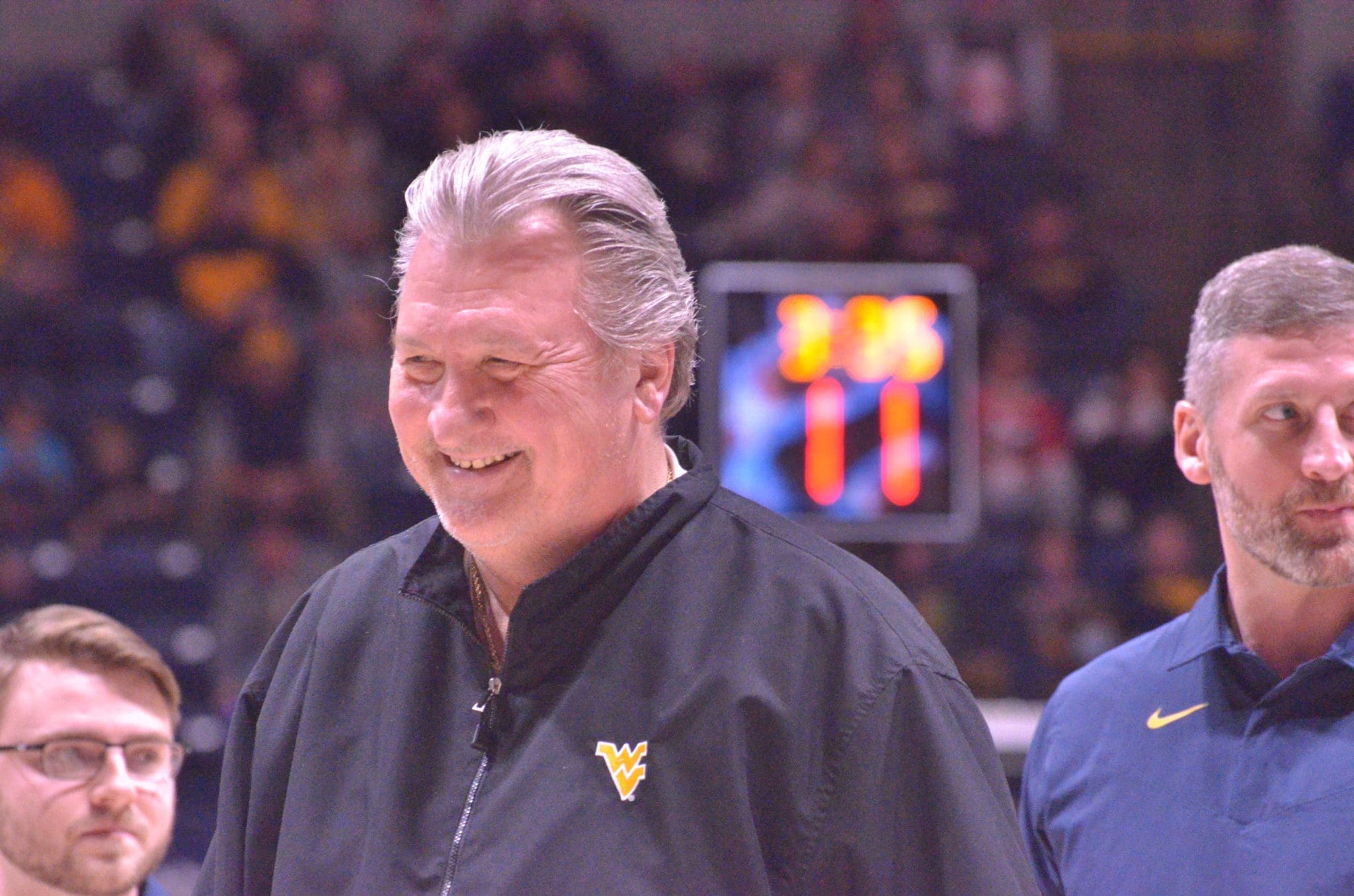 Bob Huggins smiling and Josh Eilert