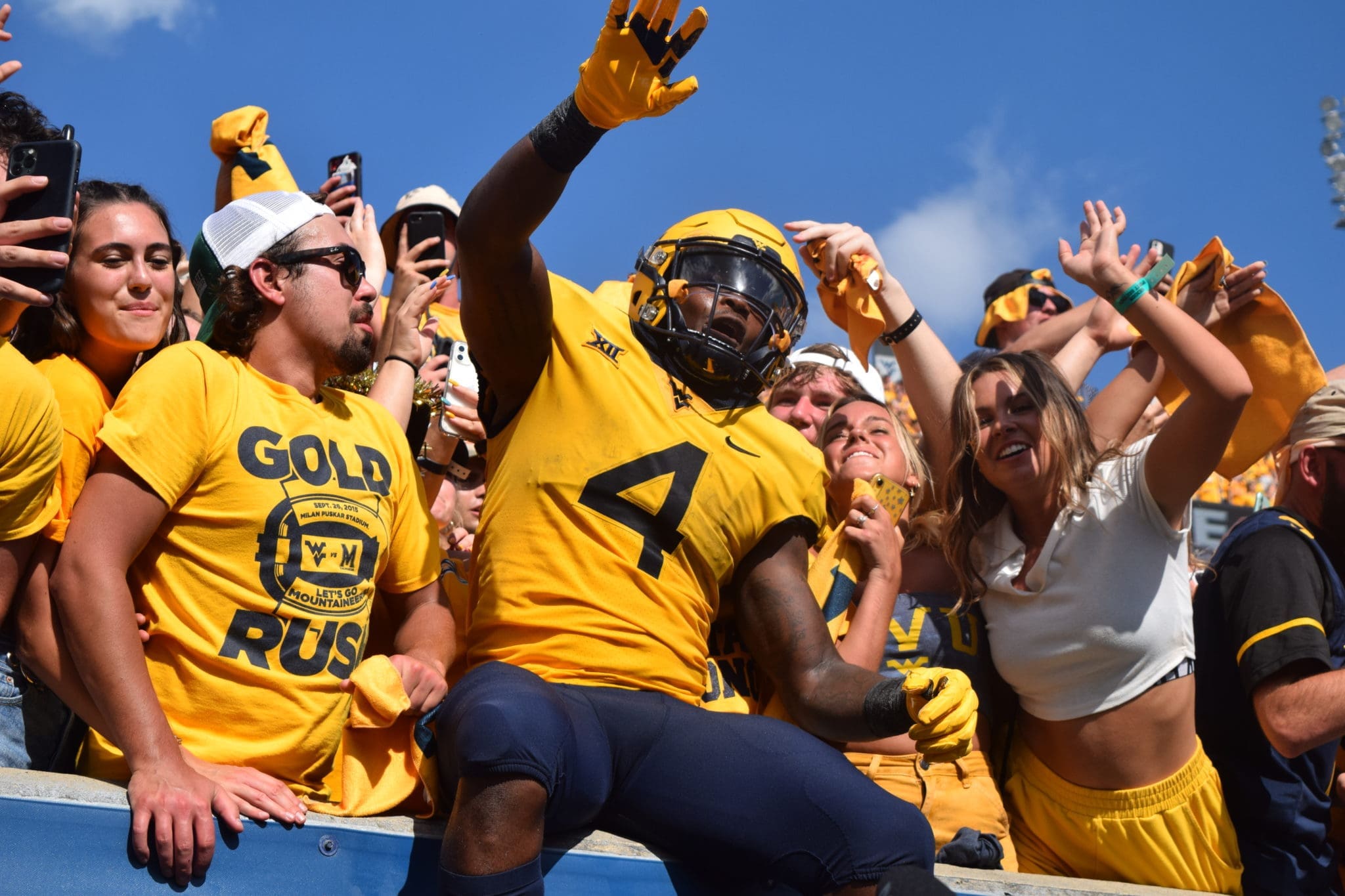 Leddie Brown with WVU Football fans