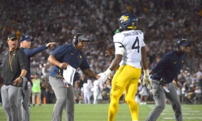 WVU Football RB CJ Donaldson and coaches Chad Scott, Bilal Marshall
