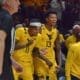 WVU Basketball Bench - Amani Hansberry and Jonathan Powell
