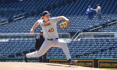 WVU Baseball pitcher Aidan Major delivers a pitch.