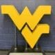 WVU logo on wall stock