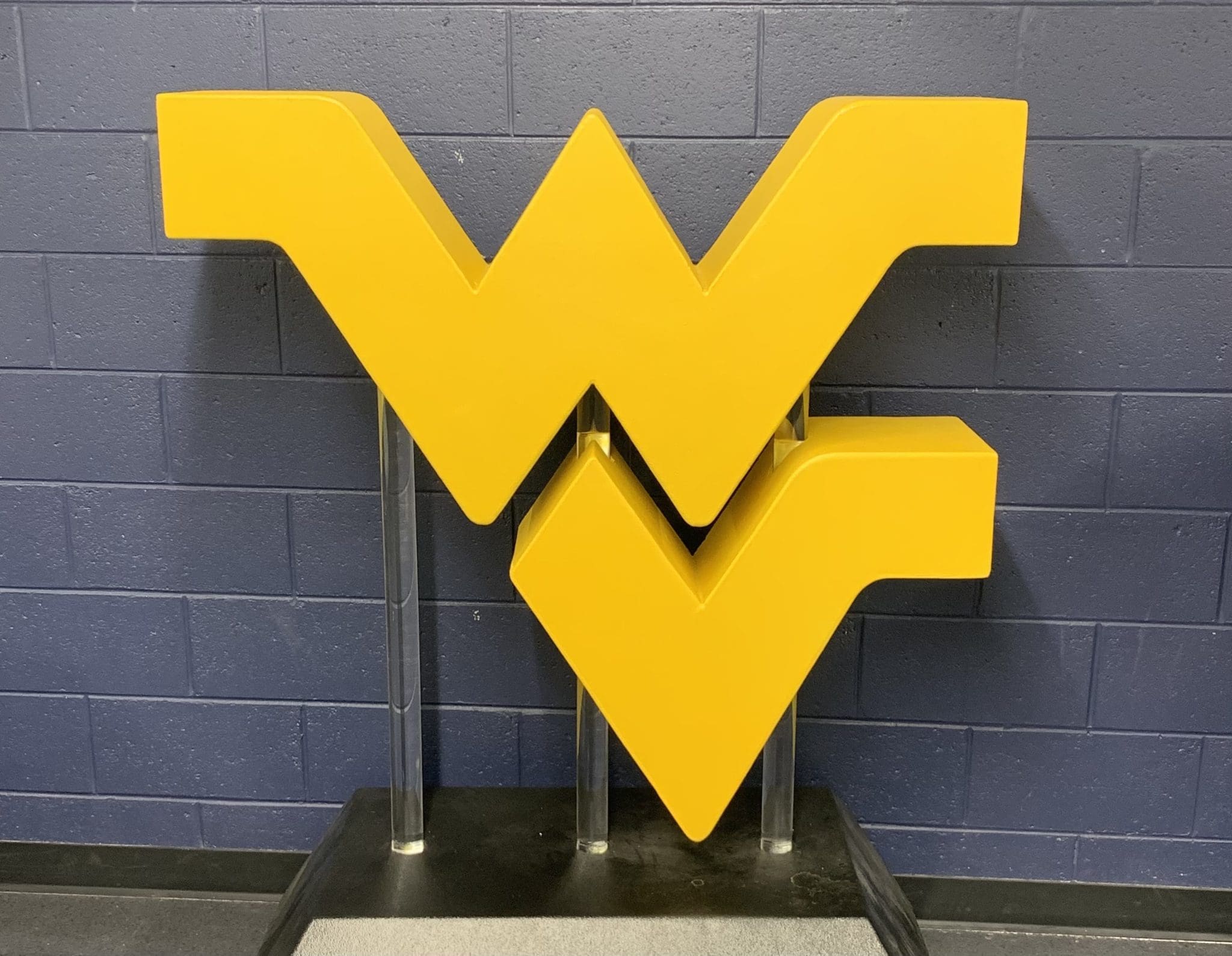 WVU logo on wall stock