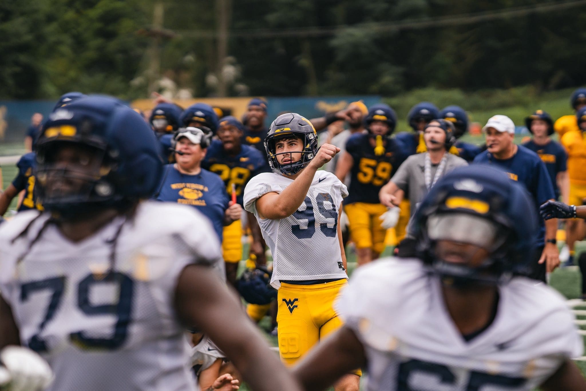 WVU Football team celebrate after Ethan Head makes kick at practice