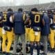 WVU Football team huddle