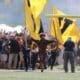 WVU Mountaineer Mascot runs on field before WVU Football game stock