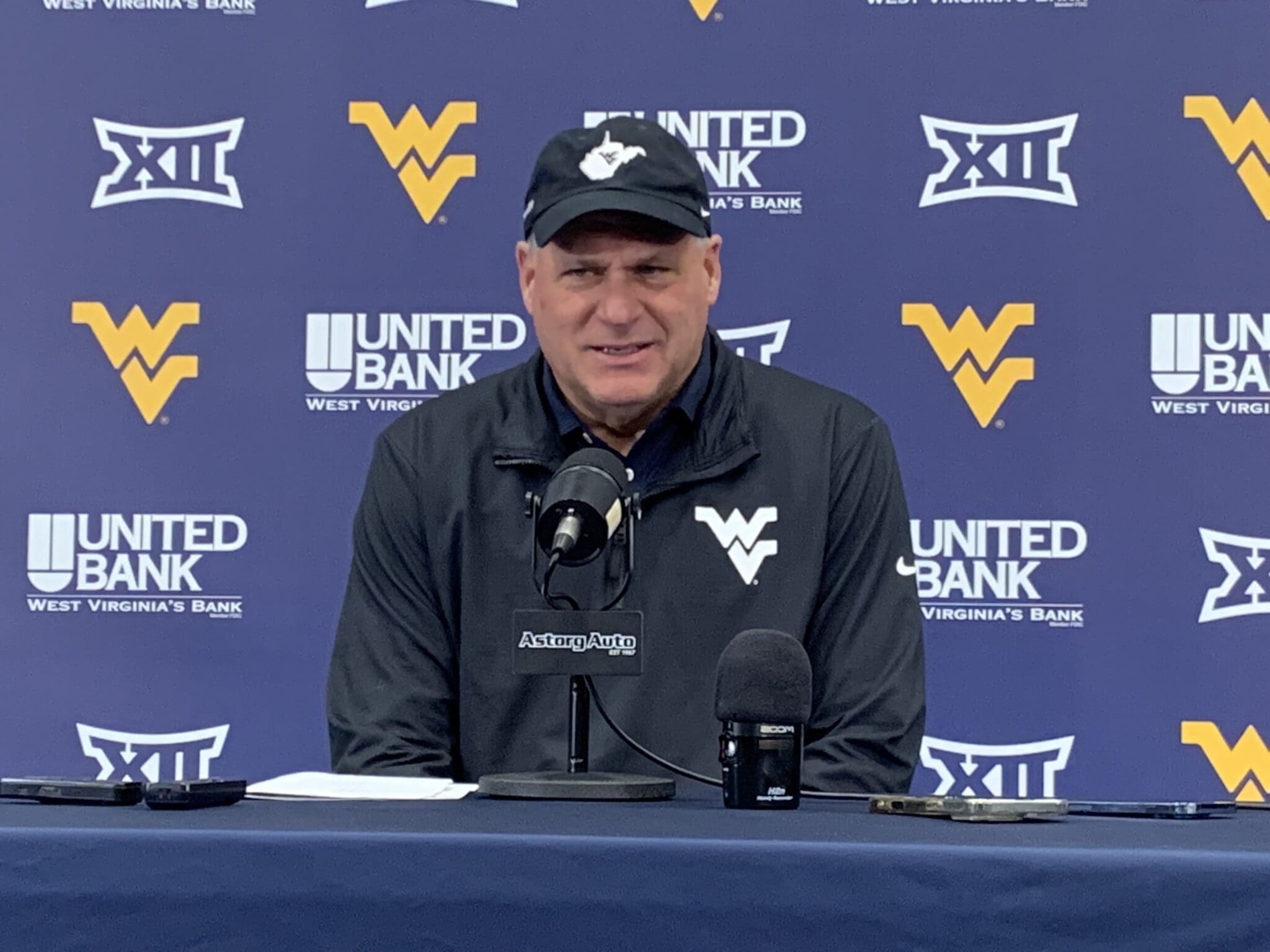 WVU Football HC Rich Rodriguez in Coal Rush gear