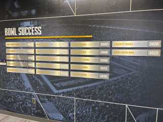 WVU Football bowl success on wall