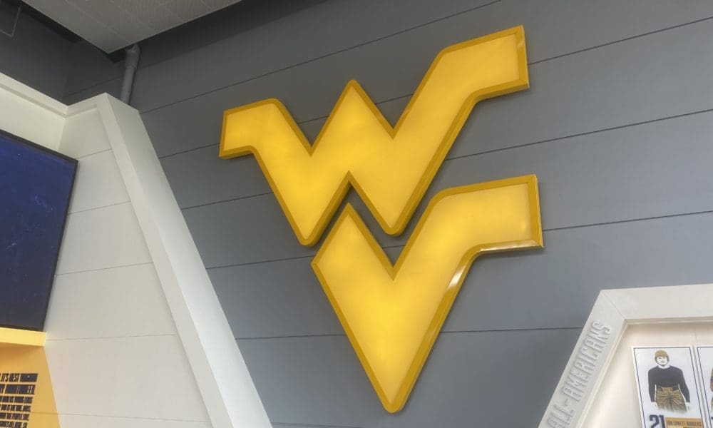 WVU logo on wall at football facility