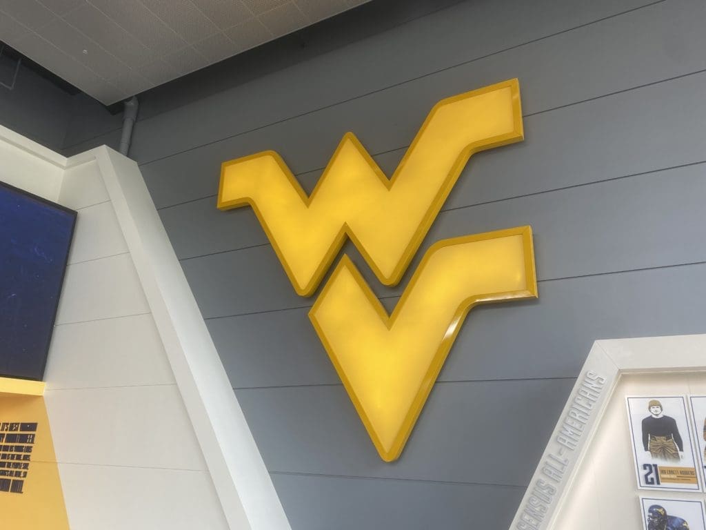 WVU logo on wall at football facility