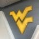 WVU logo on wall at football facility