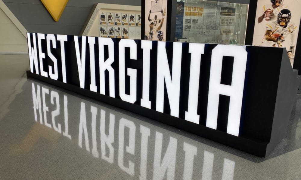 West Virginia sign at WVU Football facility stock